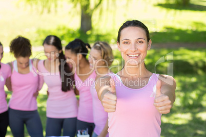 Smiling women in pink for breast cancer awareness