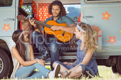 Hipster playing guitar for girls