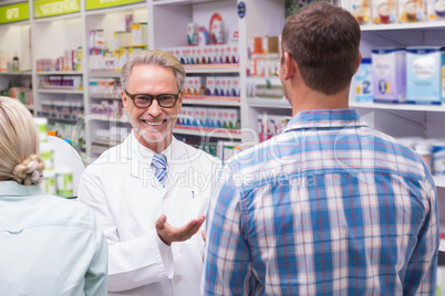 Smiling pharmacist looking at camera