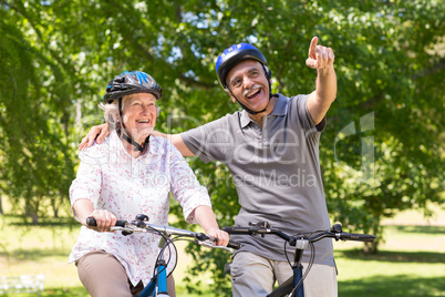 Happy senior couple on their bike