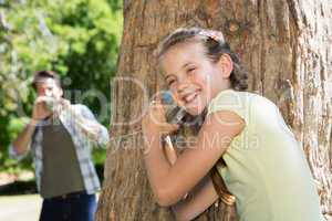 Father and daughter playing in the park