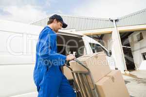 Delivery driver packing his van