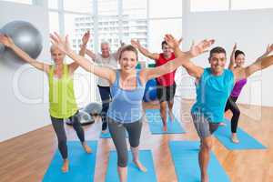 People exercising in gym class