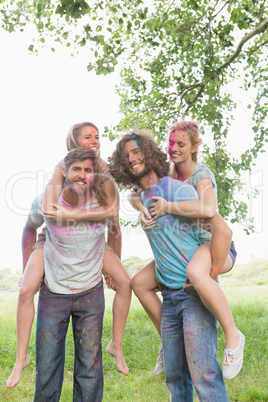 Young friends having fun with powder paint Young friends having fun with powder paint