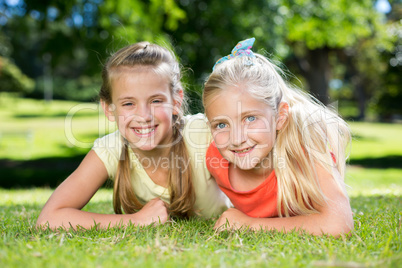 Happy sisters smiling at camera