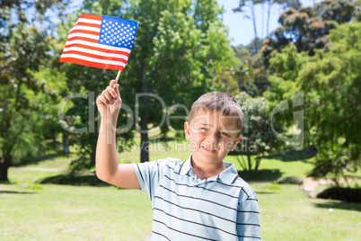 Little boy waving american flag