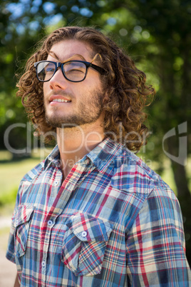 Young man thinking in the park