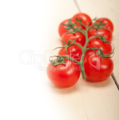 fresh cherry tomatoes on a cluster