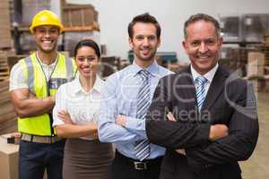 Warehouse team smiling at camera