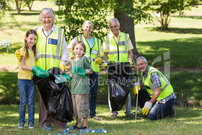 Happy family collecting rubbish