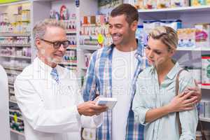 Pharmacist and costumers smiling