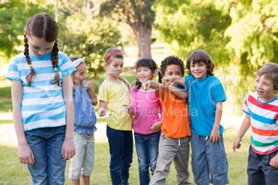 Little girl being bullied in park