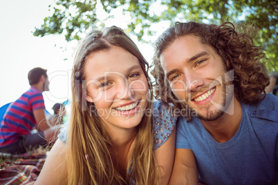 Hipster couple smiling at camera