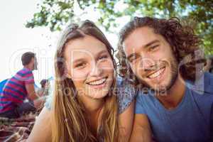 Hipster couple smiling at camera