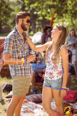 Hipster friends chatting on campsite