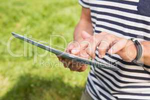 Man using a tablet in the park