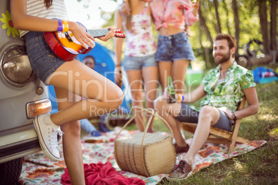 Hipsters having fun in their campsite