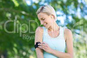 Pretty blonde jogging at the park