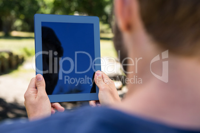 Man using tablet in the park