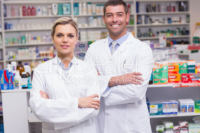 Team of pharmacists smiling at camera