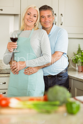 Happy mature couple smiling at camera