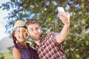 Hipster couple taking a selfie