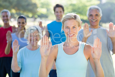 Happy athletic group showing their hands