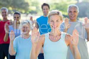 Happy athletic group showing their hands