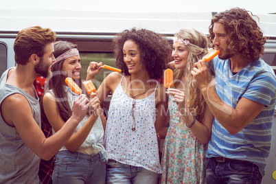 Hipster friends enjoying ice lollies