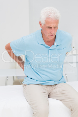 Senior patient suffering from backache