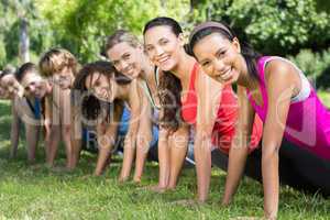 Fitness group planking in park