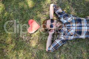 Handsome hipster relaxing in the park