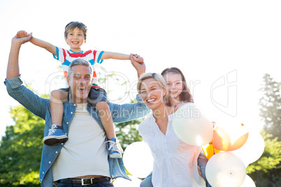 Happy family walking at the park