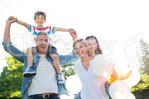 Happy family walking at the park