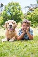 Little boy with his dog in the park