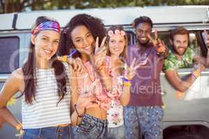 Hipsters hanging out by camper van