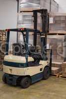 Forklift in a large warehouse