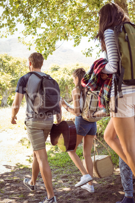 Young friends walking towards their campsite