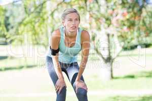 Pretty blonde jogging at the park