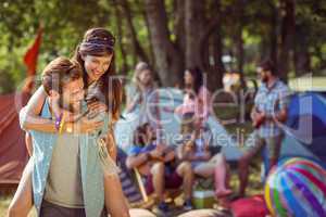 Hipster couple having fun on campsite