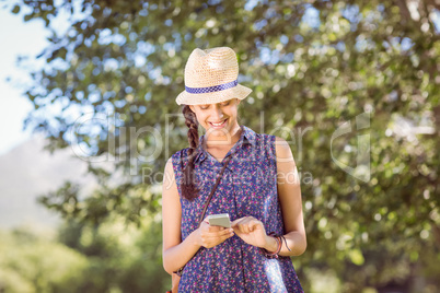 Pretty hipster checking her phone