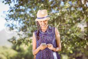 Pretty hipster checking her phone