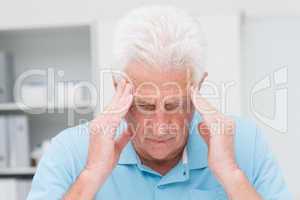 Senior patient suffering from headache