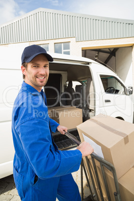 Delivery driver packing his van