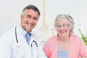 Happy doctor and patient in clinic