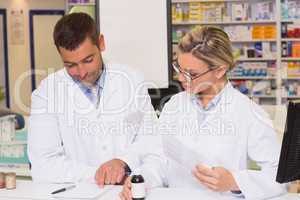 Pharmacists showing a prescription