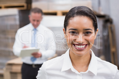 Warehouse manager smiling at camera