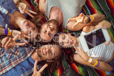 Happy hipsters posing for selfie