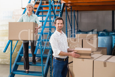 Warehouse managers loading a trolley