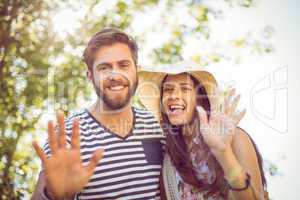 Hipster couple smiling at camera